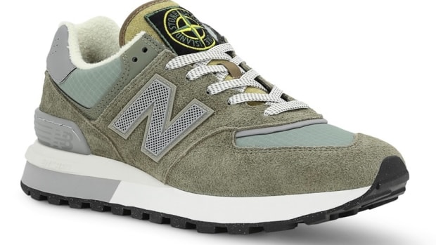 View of grey and white New Balance shoe.